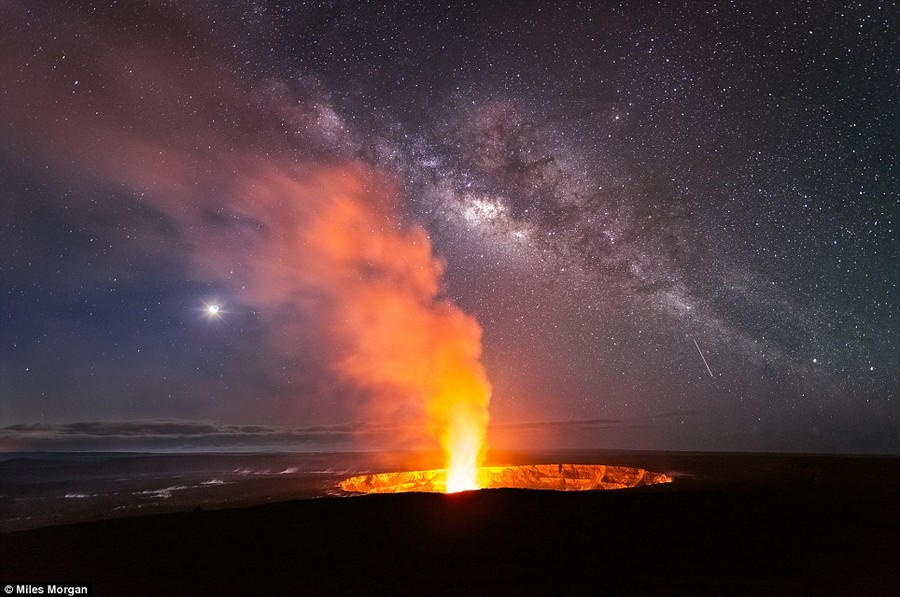 Awe-inspiring: Many elements of the night sky come together just before dawn at the Jaggar Museum Overlook of Halema'uam'u Crater in Volcano National Park near Hilo, Hawaii 