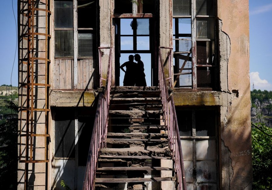 A women meets a fellow passenger in one of the many tramway stations surrounding the town. Unlike the coffee shops and newsagents of today's modern train stations, the facilities were very limited