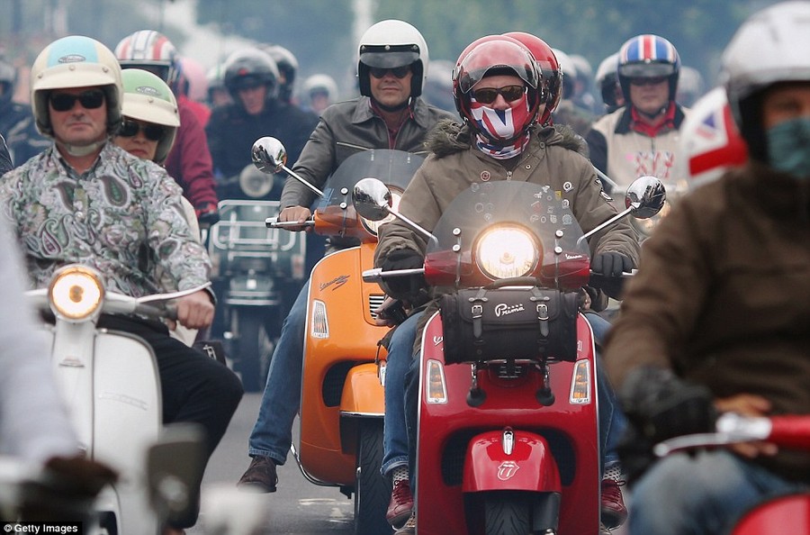 Easy riders: Thousands of scooter enthusiasts flocked to the Isle of Wight this weekend to take part in Ride Out, the world's largest scooter festival 