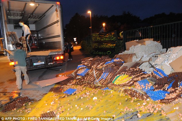 In the northwest region of Brittany, piles of mangled shell, yolk and albumen are being dumped on main roads next door to supermarkets