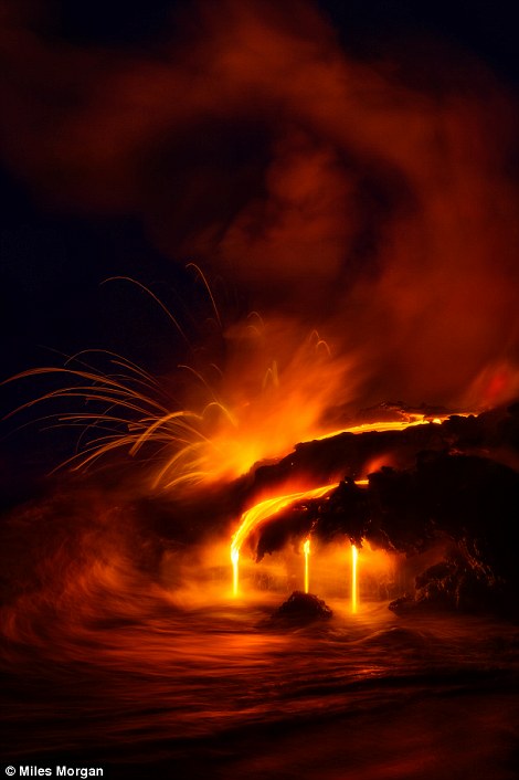 Massive explosions at dawn send lava 20 feet into the air and a huge toxic plume into the air at a large ocean entry from the Kilauea Volcano