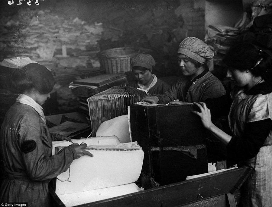 Recycling: As part of the war effort, old paper had to be reused. These women, pictured on 16th April 1917are pulling apart old ledgers belonging to the London & South West Railway