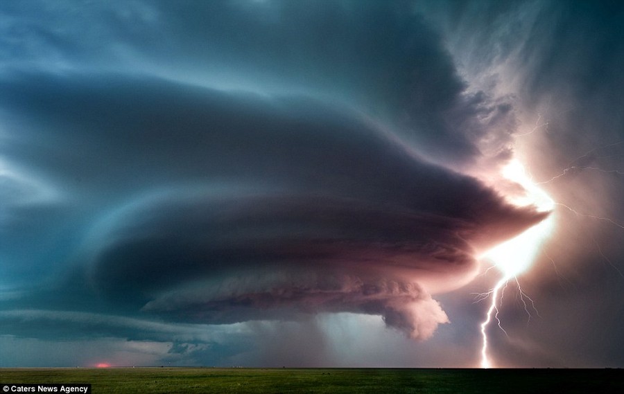 A storm brews menacingly as lightning hits a field in another incredible shot Marko uses his crucial footage from a unique ground perspective to help assist meteorologists and fellow storm chasers