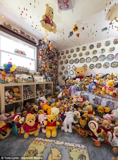 Supportive: Deb Hoffmann's husband Gary doesn't mind his wife's hobby so long as he doesn't get kicked out of bed to make room for more Winnie the Pooh collectibles 