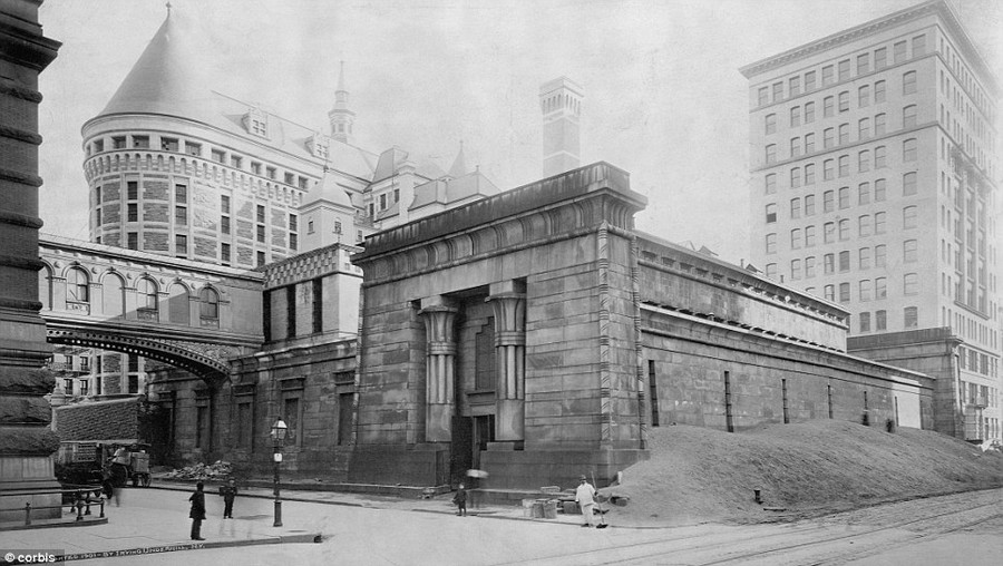 The new 1901 prison (at left) stands beside the old awaiting demolition in New York. Both prisons were called 'The Tombs'