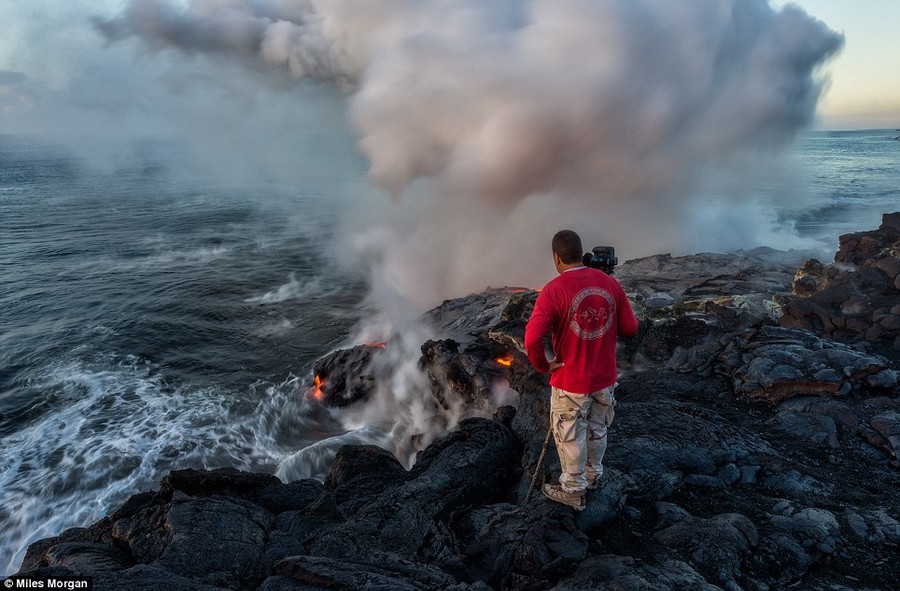 On the edge: Photographer Tom Kuali'i, of Extreme Exposure Photography, looks for the best angle to make a good image 