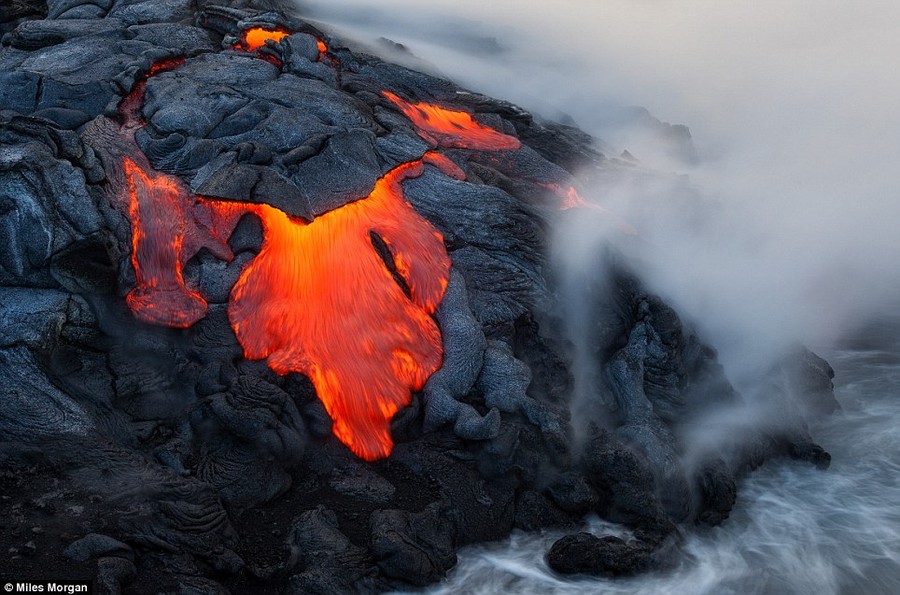 Searing heat: On many occasions, the hunt for that perfect shot has brought Morgan just inches away from bubbling, fiery lava spewing from the many craters that dot Hawaii