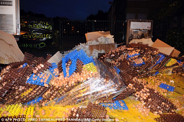 Many of the protestors have been wearing masks as they take the thousands of eggs out in the middle of the night and then throw them on to the road