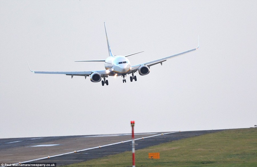 Coming in: As the big storm approaches, aircraft battle the wind and crab sideways to land at Leeds Bradford Airport in West Yorkshire